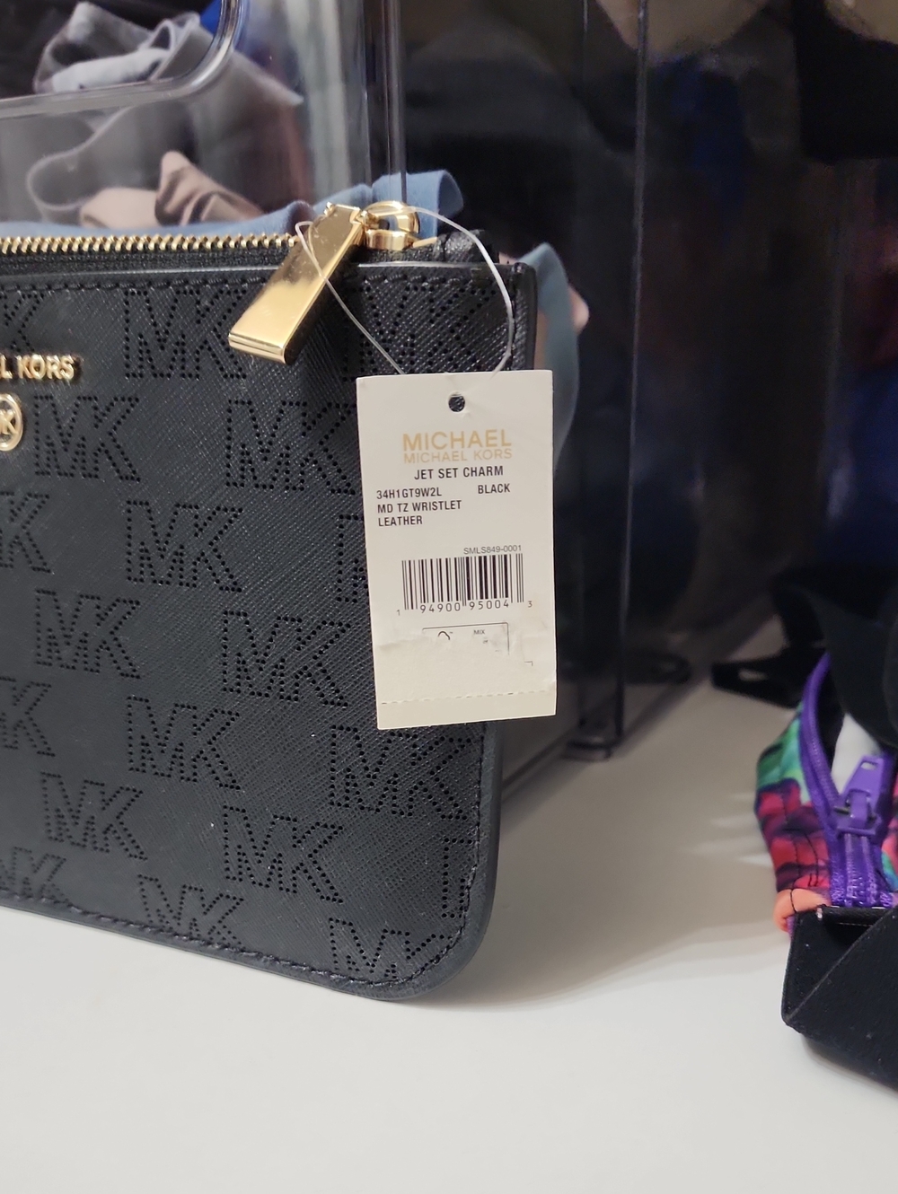 Michael Kors Black Perforated MK Leather Wristlet with Gold Hardware